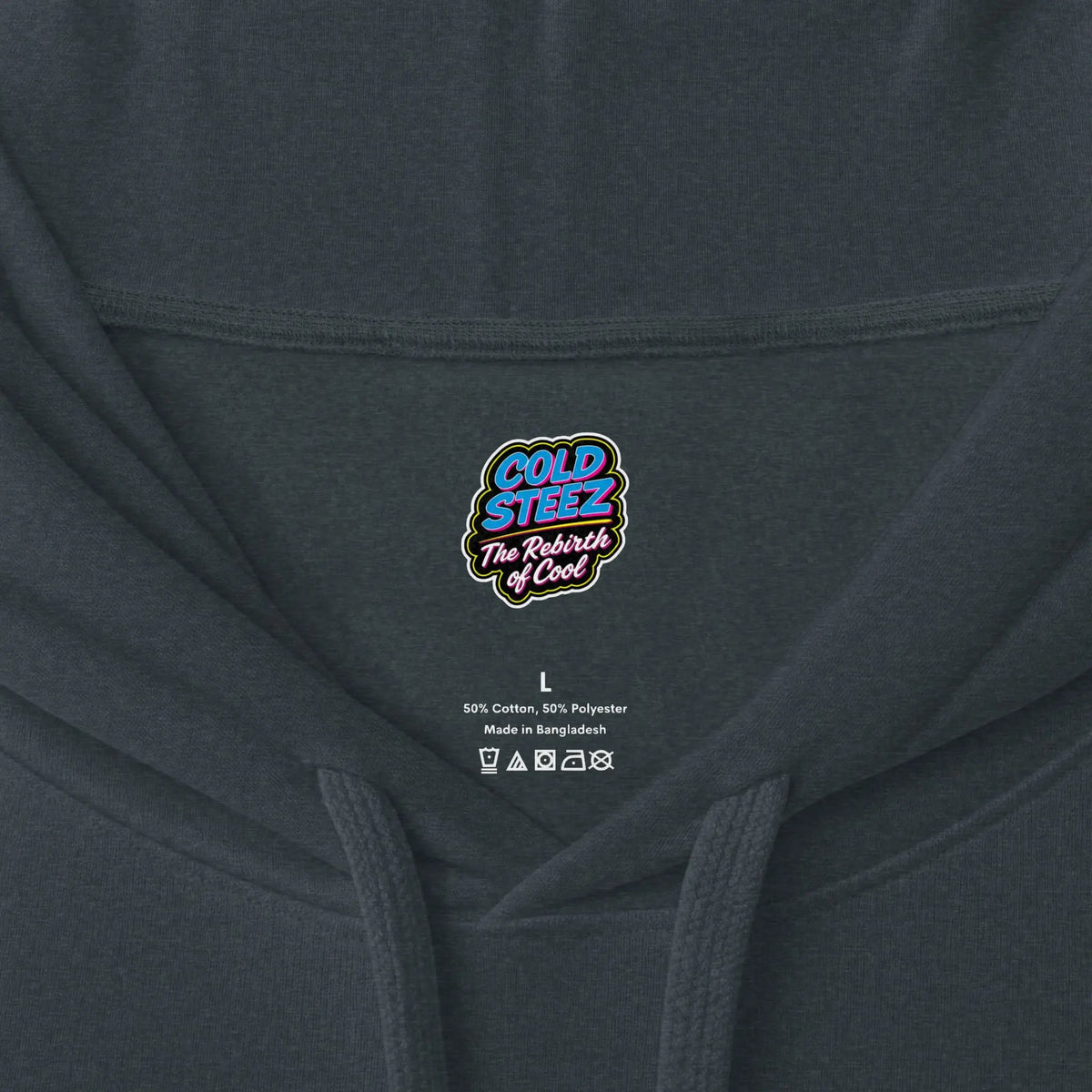 Close-up of a dark charcoal gray hoodie showing the inner neck label with the brand logo 'COLD STIZZ The Rebels of Cool' and size/manufacturer details.